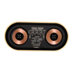 A wireless charger in black and gold featuring two copper charging coils and electronic components visible underneath.