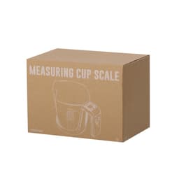 A brown cardboard box containing a measuring cup scale, featuring an illustration of the product on the side.