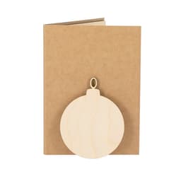 A brown notebook with a wooden ornament attached to the front cover, featuring a circular shape and a loop.