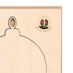 A wooden ornament design featuring a hole for hanging and a compartment for pine seeds.