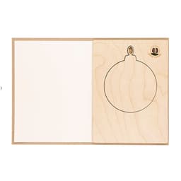 A wooden card featuring an outline of a round ornament on the left side and a blank space on the right.