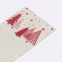A rectangular card featuring red Christmas trees and stars on a light background. It has a festive design.