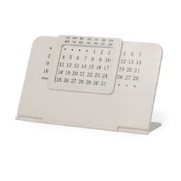 A desk calendar in white, featuring a flip-style design and displaying dates and days of the week.
