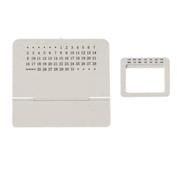 A desk calendar featuring a minimalist design in a light colour with a separate section for the days of the week.