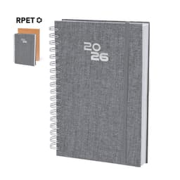 A grey spiral-bound diary with a textured cover, featuring the year 2026 and a logo.