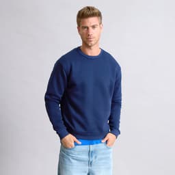 A navy blue hoodie worn by a model, featuring a round neckline and long sleeves. The model stands against a neutral background.
