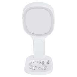A white mirror stand with a square mirror and a base featuring a decorative necklace.