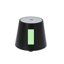 A black lamp with a cylindrical base and a white top, featuring a green accent. It has a logo on it.