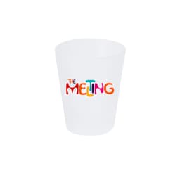 A frosted glass shot glass featuring colourful, playful text. The glass has a round shape and a smooth surface.