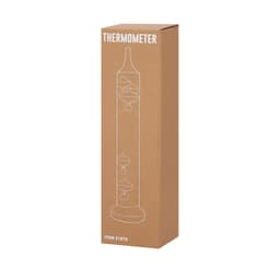 A boxed Galileo thermometer with a clear glass design and colourful floating glass orbs, displayed on a brown packaging.