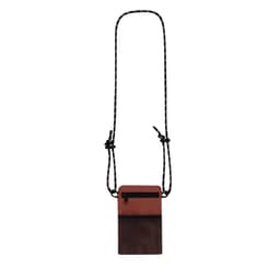 A brown and black Veltox Bag with adjustable cord, featuring one zippered pocket and a textured panel.