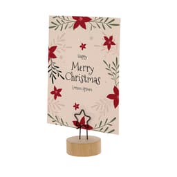 A decorative stand featuring a star-shaped holder and a card with floral designs, wishing "Merry Christmas" in festive colours.