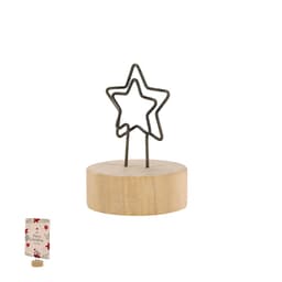 A wooden base with a metal star-shaped clip at the top, holding a decorative card. The base is light wood, and the clip is dark metal.