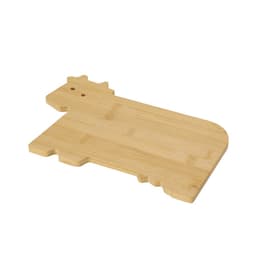 A bamboo chopping board shaped like a cow, featuring a smooth surface and a natural finish.