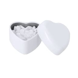 A heart-shaped white container filled with small white mint candies, featuring a glossy finish and a metallic interior.