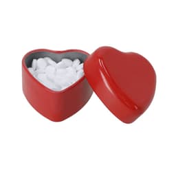 A red heart-shaped container with a lid, filled with white mints inside.