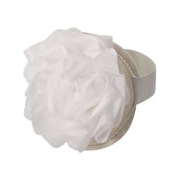 A hair accessory featuring a large white flower design on a beige band, accompanied by a logo.