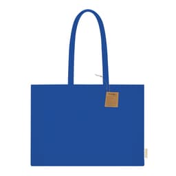 A blue tote bag with two handles and a tag attached. The bag features a simple, solid design.