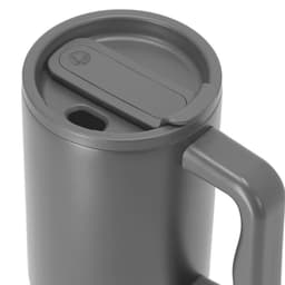 A drink mug in grey featuring a lid with a sliding opening and a handle. The design includes a logo.