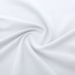 A close-up view of white fabric, showcasing its smooth texture and soft drape.