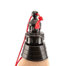 A drink bottle with a black screw cap and a red pull tab, featuring a textured tan body.