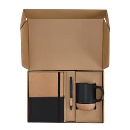 A gift set featuring a black mug, cork notebook, and black pen, all packaged in a cardboard box.