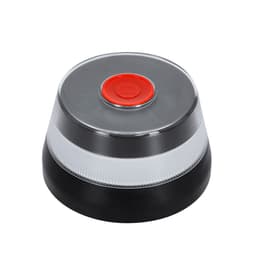 A round tech gadget in black with a clear base and a red button on top, featuring a logo.