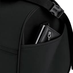 A black Velor Bag with a visible pocket containing a black wallet. The bag features adjustable straps and a logo.