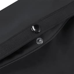A black Velor Bag featuring a snap button closure and textured strap. The interior has a smooth finish.