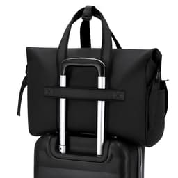 A velor black bag resting on a suitcase, featuring sturdy handles and a logo.