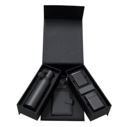 A black gift box containing a drink bottle, a wallet, and two tech accessories, all in black.