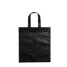 A black tote bag with two handles and a small logo. The bag has a simple and sturdy design.