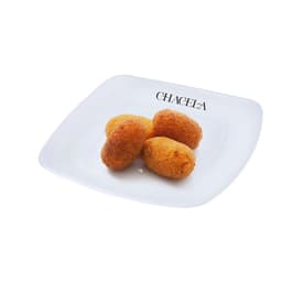 A white plate with a logo features four golden-brown croquettes arranged neatly.