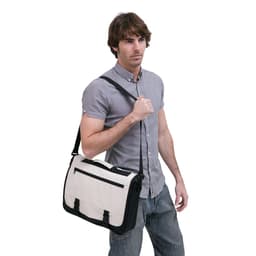 A beige and black messenger bag is being carried by a man wearing a grey shirt and light-coloured jeans. The bag features a logo.