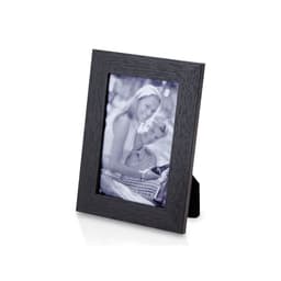 A black photo frame with a wooden texture displaying a black and white photograph of a couple.