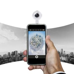 A smartphone with a circular camera attachment displays a cityscape image. The device features a logo and is in a sleek design.