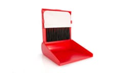 A red cleaning set featuring a dustpan with an integrated brush, designed for easy storage and use.