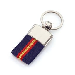 A navy blue keyring with red and yellow stripes, featuring a shiny metal attachment.
