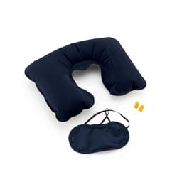 A navy blue travel pillow, eye mask, and earplugs arranged together in a flat lay. The pillow has a unique shape.