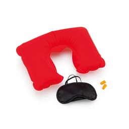 A red inflatable neck pillow, black sleep mask, and earplugs arranged together. The pillow has a logo on it.
