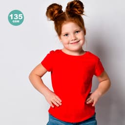 A child wears a bright red t-shirt, smiling with hands on hips, against a plain background. The shirt has a logo.