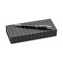 A black Dacox pen rests on a grid-patterned black box. The pen features a metallic finish and a sleek design.