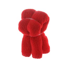 A red towel folded in a decorative shape, featuring a logo, suitable for gym and outdoor activities.