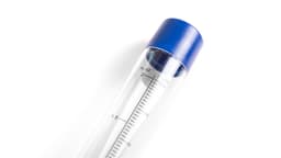 A clear drink bottle with a blue cap, featuring measurement marks in fluid ounces and millilitres.