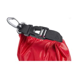 A red dry bag with a black clip and adjustable strap, featuring a textured surface. It has a logo on it.