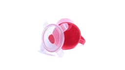 A pink jar with a clear lid sits upside down, showcasing its interior. The jar has a handle and a sleek design.