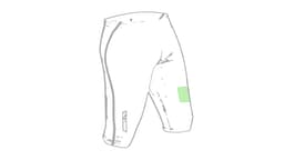 A pair of sports shorts in grey with a green patch, featuring a logo on the side.