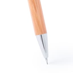 A wooden pen with a bamboo design and a shiny silver tip, positioned above a blank surface.