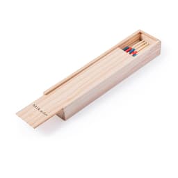 A wooden box containing Mikado game sticks, with various colours including red and blue. The box has a logo.