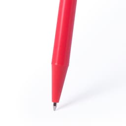 A red pen with a smooth body and a pointed tip, featuring a logo.